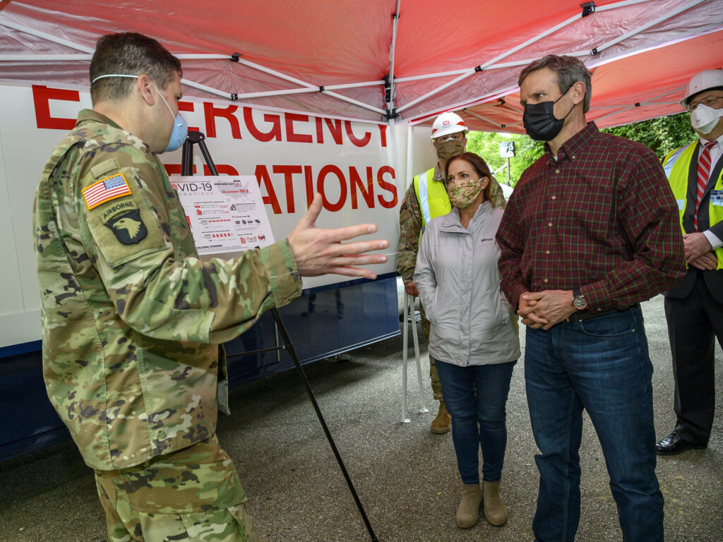 Tennessee Gov. Bill Lee, right, tours a temporary hospital site in April with his wife Maria Lee. The overflow hospital, intended to help with the surge in COVID-19 hospitalizations, won’t be able to take patients if there aren’t additional doctors and nurses available to provide treatment. Tennessee Gov. Bill Lee, right, tours a temporary hospital site in April with his wife Maria Lee.