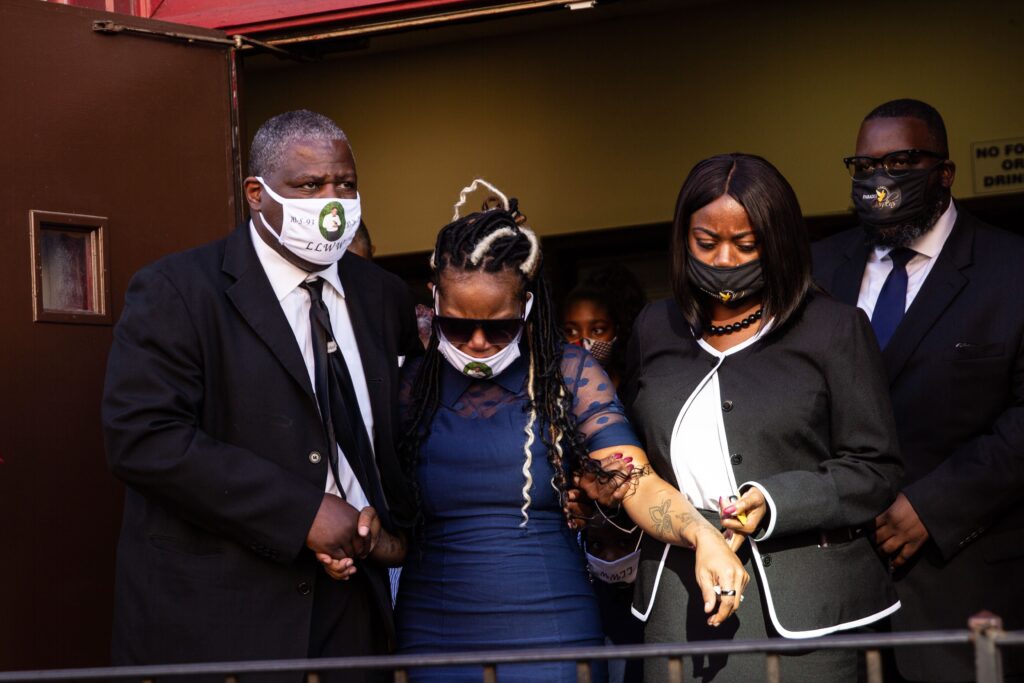 walter_wallace_jr_funeral_KP_110720_12 Dominique Wallace (center) leaves the funeral of her late husband, Walter Wallace Jr.