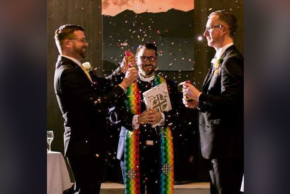 wedding-2 Rev. Fritz Fowler (center) marries Ted Sayland (left) and Rusty McCarty (right) in 2018. (Courtesy of Abigail Townsend Photography)