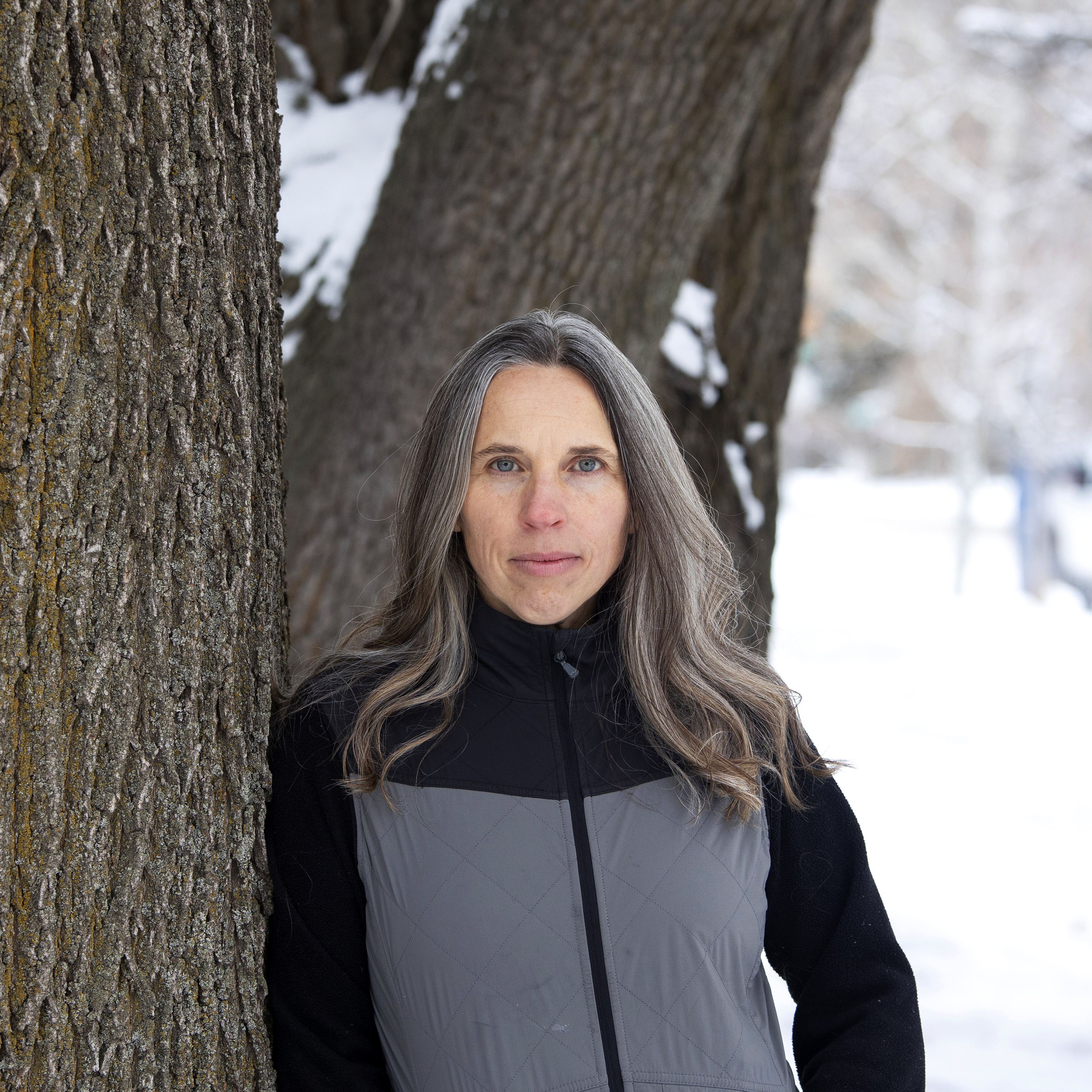 On December 15, 2020, in Bozeman, Montana, Angela Kociolek stands for a portrait by a tree in her front yard.