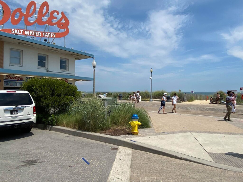 116022158_2668277510086736_1666585288209754571_n The Dolles sign atop the salt water taffy story has been a landmark in Rehoboth Beach for more than a half-century. (Butch Comegys for WHYY)