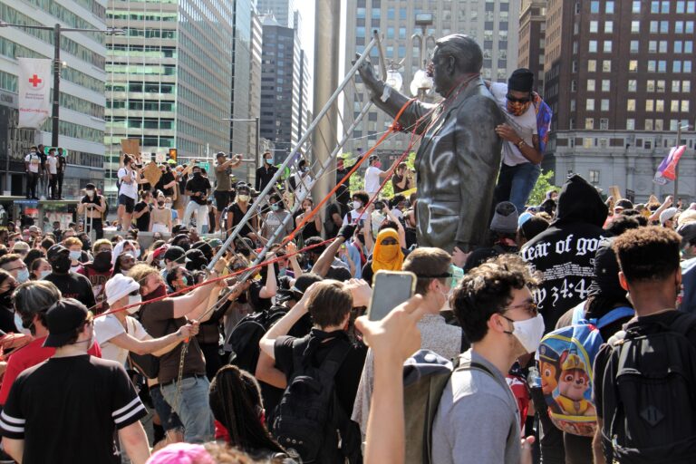 Protesters try to take down the statue of former mayor and police chief Frank Rizzo