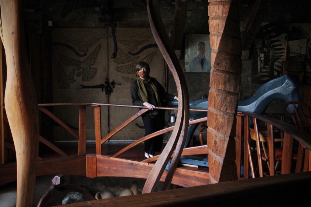 2020 12 09-e lee-julie siglin-tredyffrin township pa-wharton esherick museum home studio interior Julie Siglin looks at the sculptures displayed in Wharton Esherick's home studio