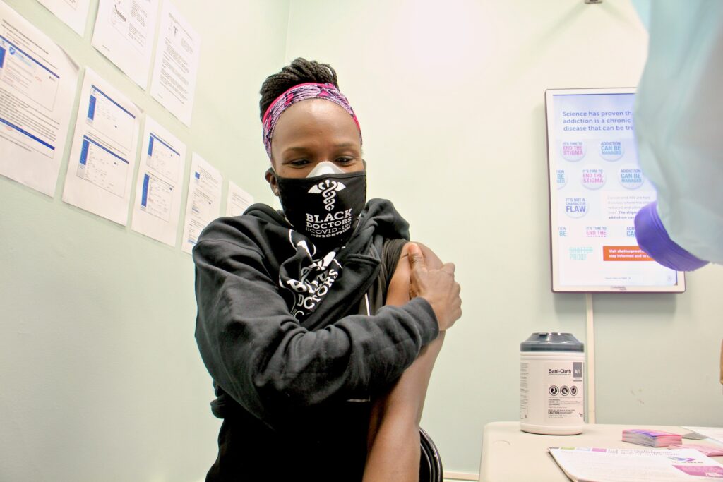 2020 12 16-e lee-ala stanford-philadelphia-black doctors consortium covid 19 vaccine Dr. Ala Stanford gets her COVID-19 vaccination at a Philadelphia Department of Health clinic on Dec. 16, 2020. (Emma Lee/WHYY)