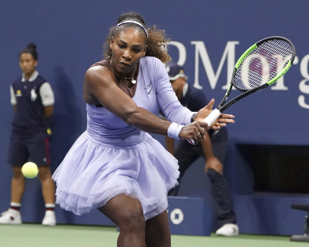 women-100-Serena-Williams Serena Williams getting ready to hit a tennis ball