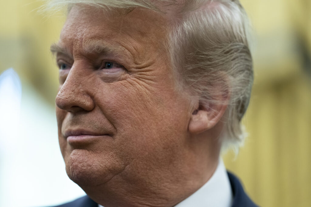 Donald Trump, Lou Holtz President Donald Trump listens during a ceremony to present the Presidential Medal of Freedom to former football coach Lou Holtz, in the Oval Office of the White House, Thursday, Dec. 3, 2020, in Washington. (AP Photo/Evan Vucci)