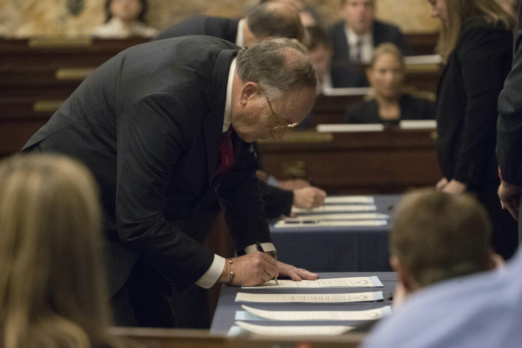 Electoral College-Pennsylvania In this file photo from Dec. 19, 2016, elector Robert Gleason certifies the results during Pennsylvania's 58th Electoral College at the state Capitol in Harrisburg, Pa., Monday, Dec. 19, 2016. (AP Photo/Matt Rourke)