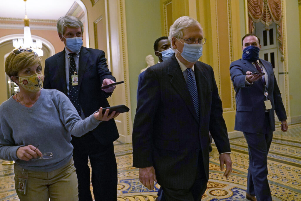 Mitch McConnell Senate Majority Leader Mitch McConnell of Ky., walks past reporters on Capitol Hill in Washington, Tuesday, Dec. 15, 2020. (AP Photo/Susan Walsh)