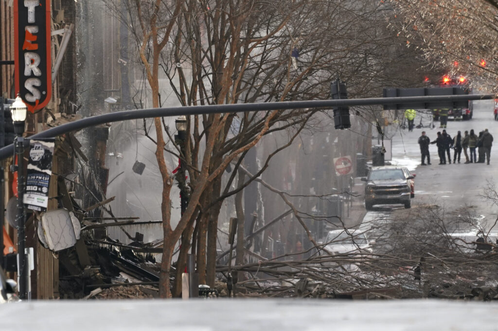 APTOPIX Nashville Explosion Emergency personnel work at the scene of an explosion in downtown Nashville, Tenn., Friday, Dec. 25, 2020. Buildings shook in the immediate area and beyond after a loud boom was heard early Christmas morning. (AP Photo/Mark Humphrey)