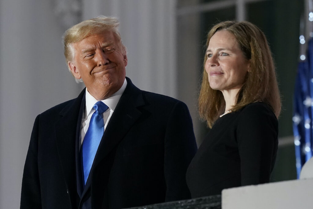 Donald Trump, Amy Coney Barrett In this Monday, Oct. 26, 2020 file photo, President Donald Trump and Amy Coney Barrett stand on the Blue Room Balcony after Supreme Court Justice Clarence Thomas administered the Constitutional Oath to her on the South Lawn of the White House White House in Washington. (AP Photo/Patrick Semansky)