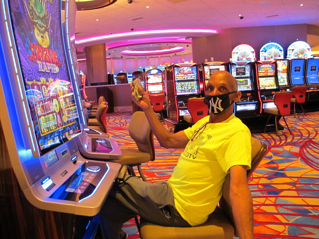 Atlantic City 2021 Gary Royster of Atlantic City holds up cash he used to gamble at the Hard Rock casino in Atlantic City on July 2, 2020, the day the casino reopened after being shut down for months amid the coronavirus outbreak. (AP Photo/Wayne Parry)