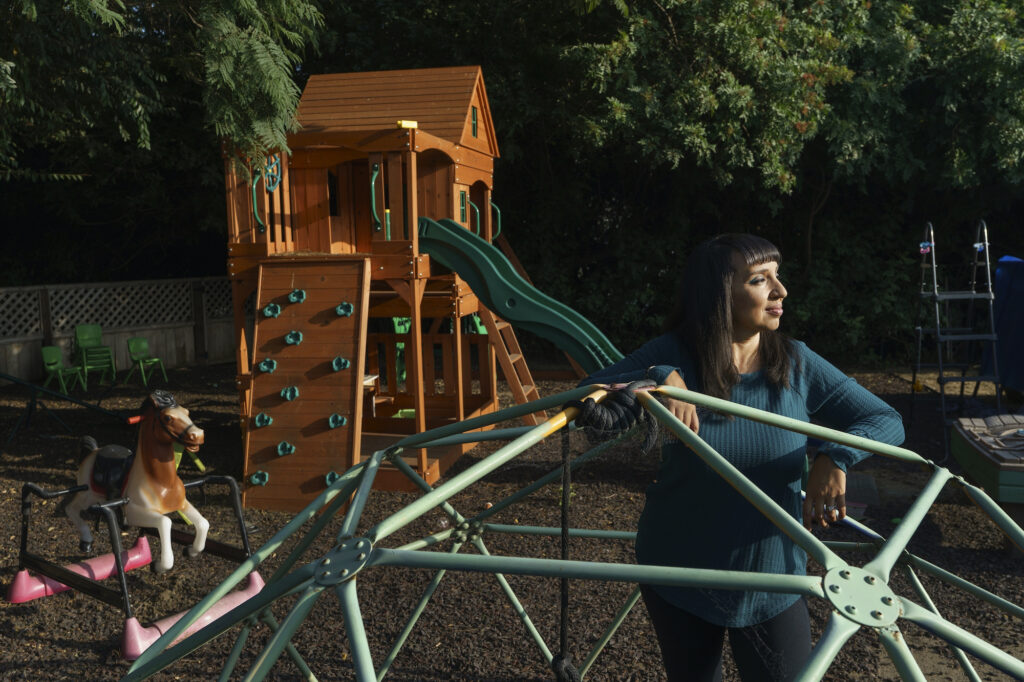 Mary De La Rosa Mary De La Rosa stands inside a geodesic play structure at her home back yard