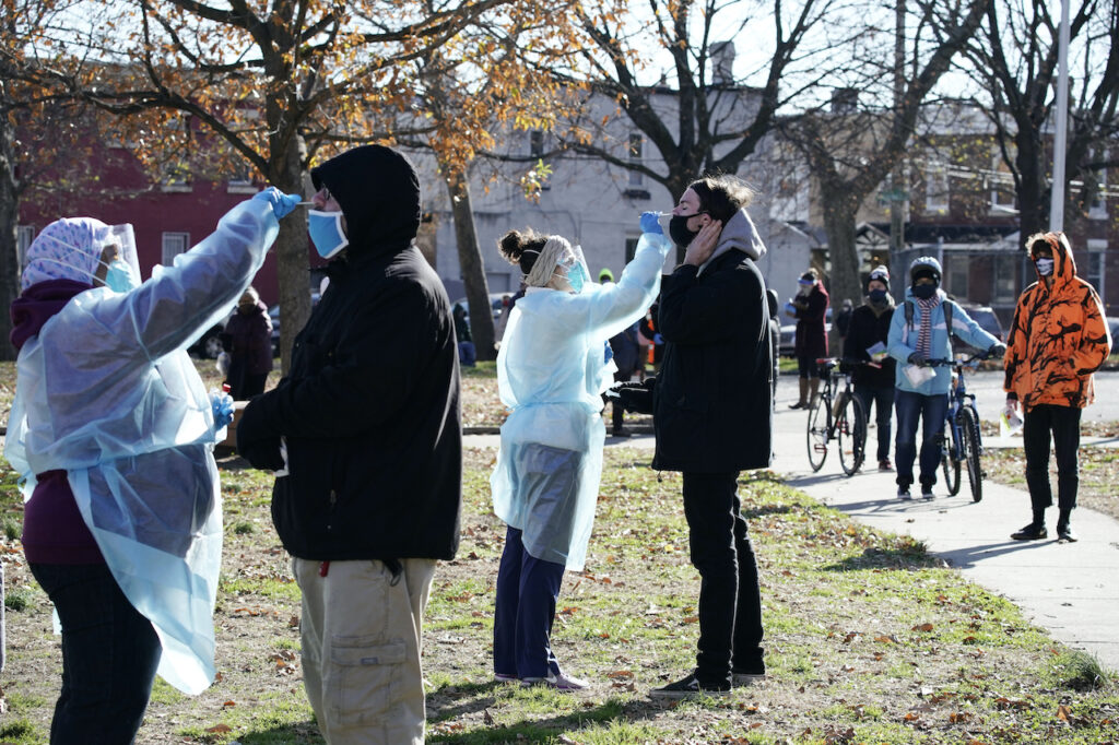 Virus Outbreak Pennsylvania Registered nurses swab patients during testing for COVID-19 at Mifflin Square Park