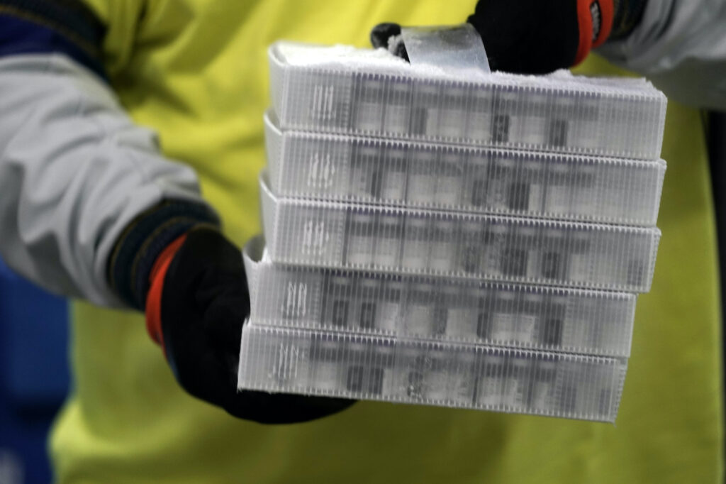 APTOPIX Virus Outbreak Pfizer Vaccine Boxes containing the Pfizer-BioNTech COVID-19 vaccine are prepared to be shipped at the Pfizer Global Supply Kalamazoo manufacturing plant