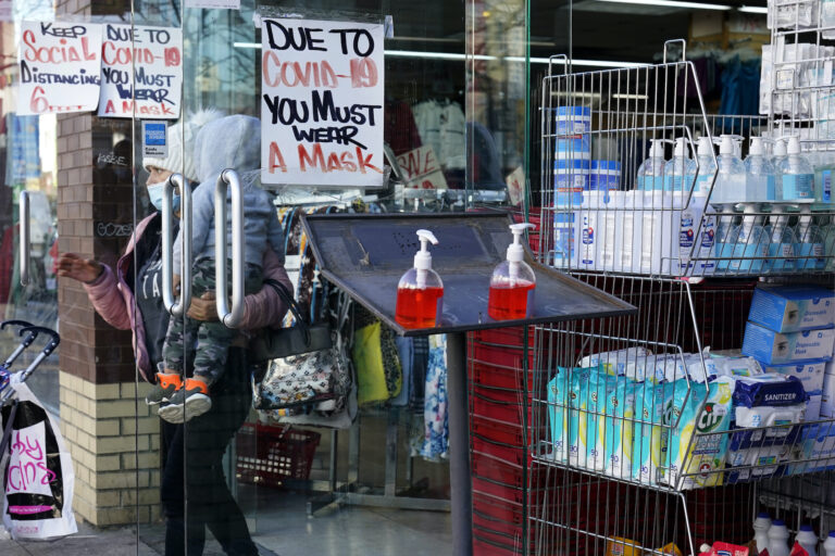A sign warns patrons to wear a mask in the Ironbound section of Newark