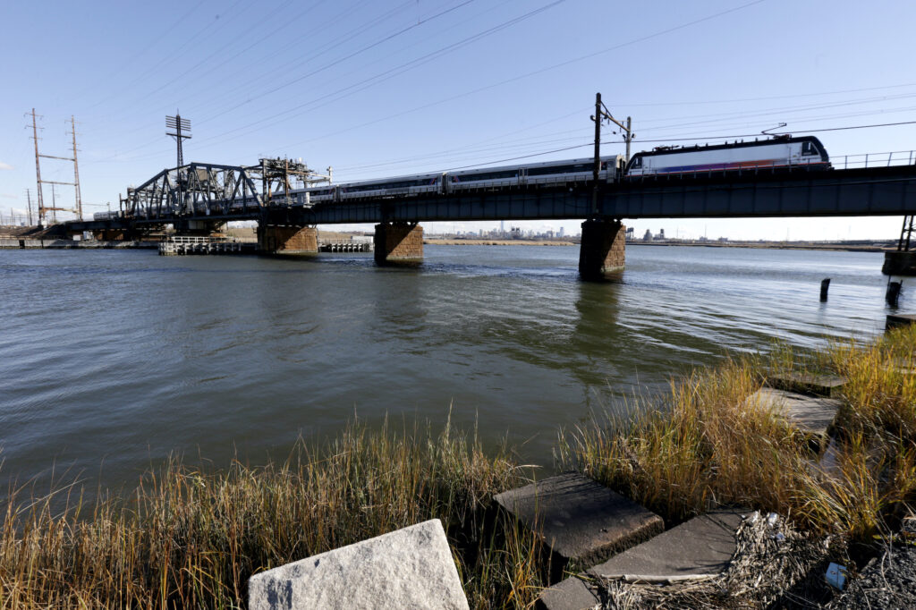 Northeast Corridor-Rail Bridge A New Jersey Transit train rides across a portal bridge