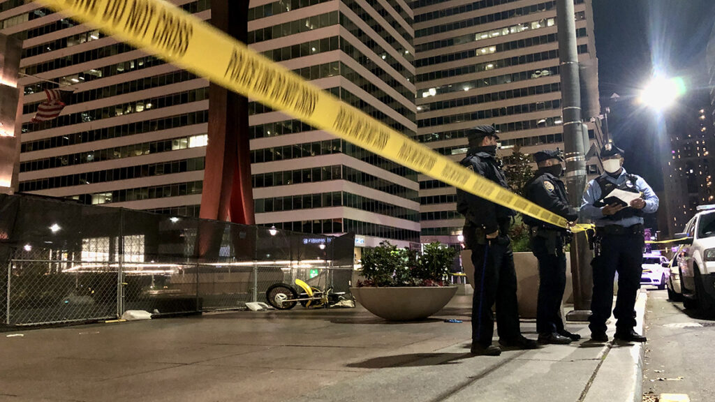 Clothes-Pin-Statue-Shooting Police stand by the Clothespin Sculpture near City Hall, where a dirt bike rider was fatally shot on Nov. 16, 2020.