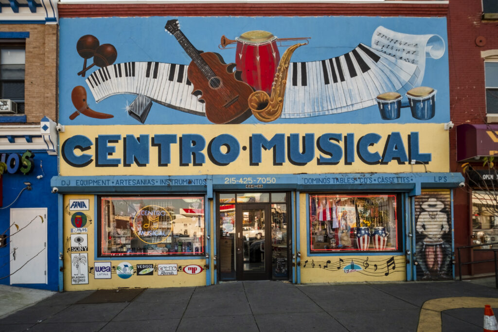 DSCF4686 Centro Musical, located in the heart of El Bloque de Oro, is a music shop and gathering for Latinos in the community. | Centro Musical en el corazón de El Bloque de Oro, es una tienda de música y un encuentro para latinos en la comunidad. (Photo by Bernardo Morillo for WHYY)