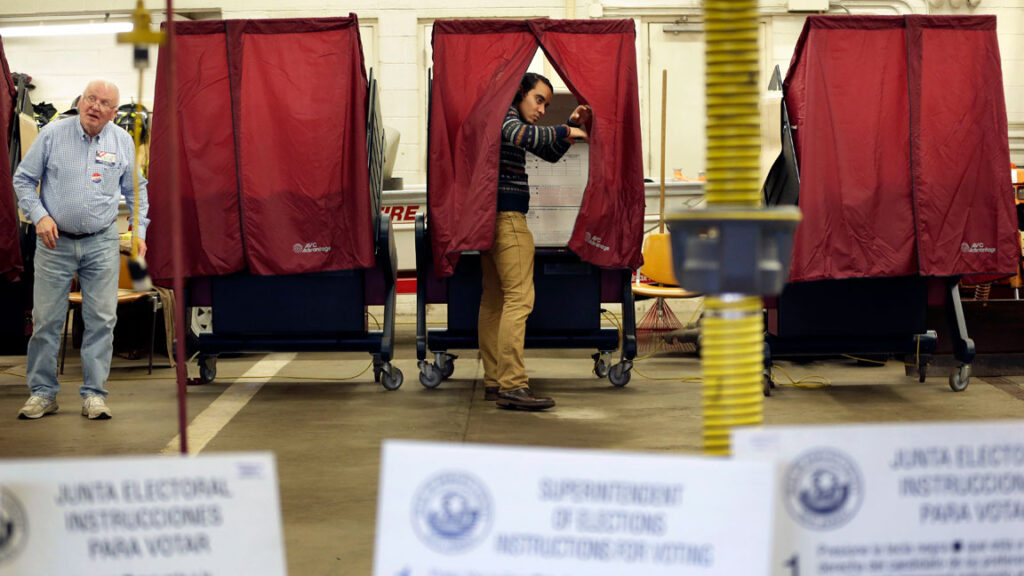 Election-NJ-electors-voting-booth-ballot A voter exits their voting booth