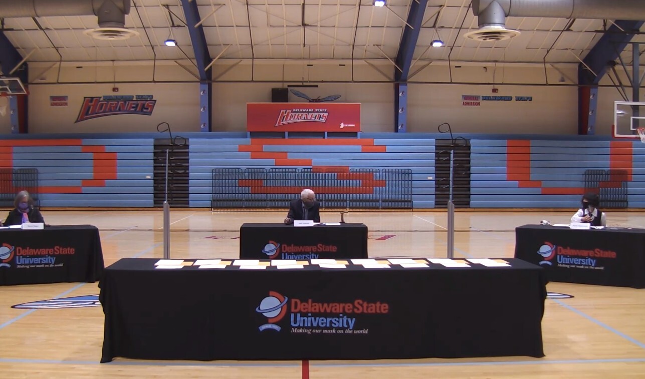 Delaware's three electors gather inside the gymnasium at Delaware State University in Dover to cast the state's three Electoral College votes for Joe Biden and Kamala Harris.