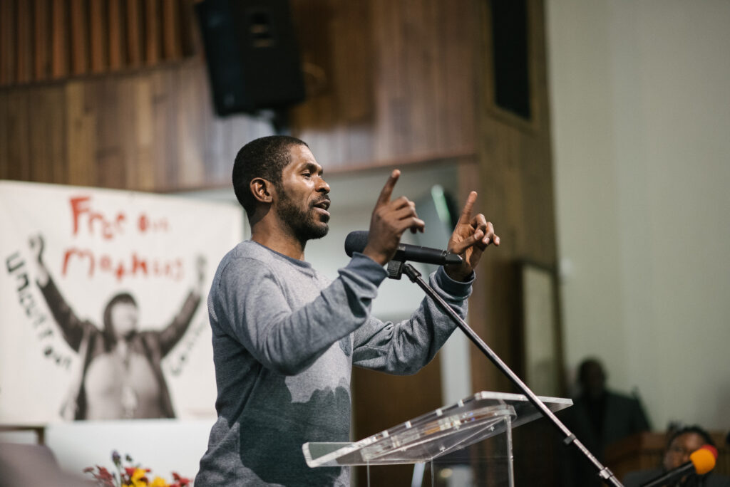 HLY_8573 Dante Jones speaking at the People's Hearing at Eastern State Penitentiary in January