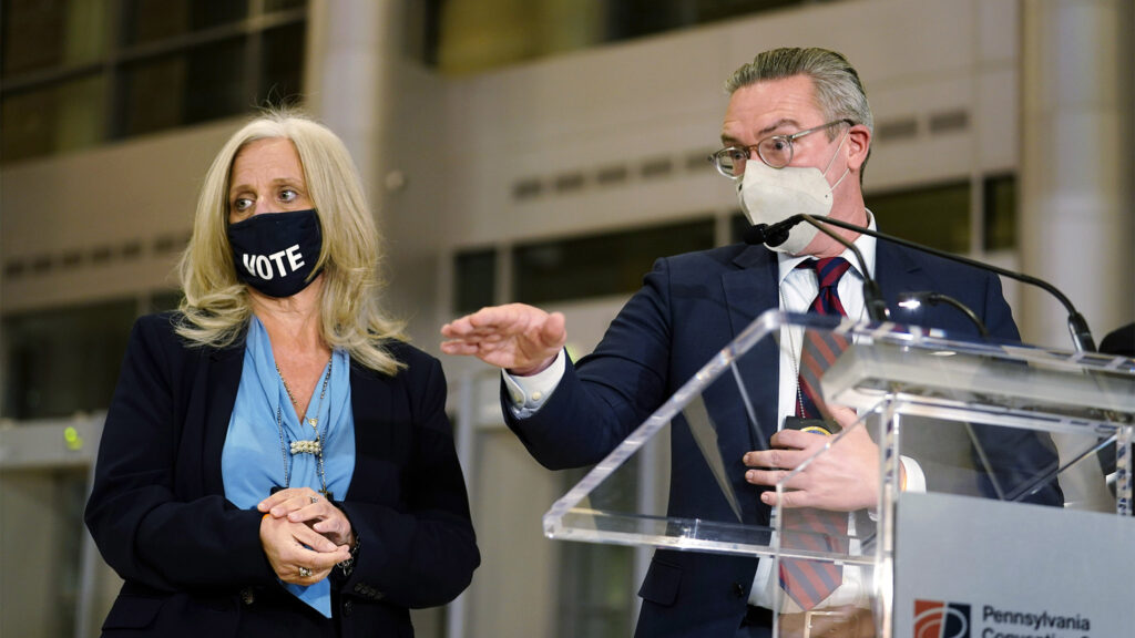 Philadelphia City Commissioners Al Schmidt, right, and Lisa Deeley speak to the media as election workers process ballots for the general election, at the Pennsylvania Convention Center, Tuesday, Nov. 3, 2020, in Philadelphia. (AP Photo/Matt Slocum)