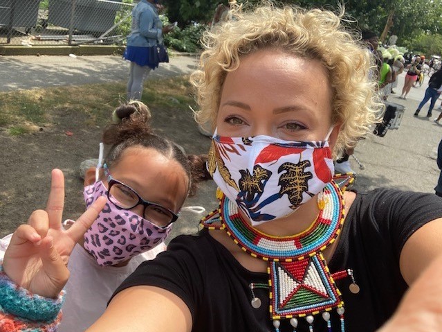 Ana Braxton wears a mask alongside one of her children