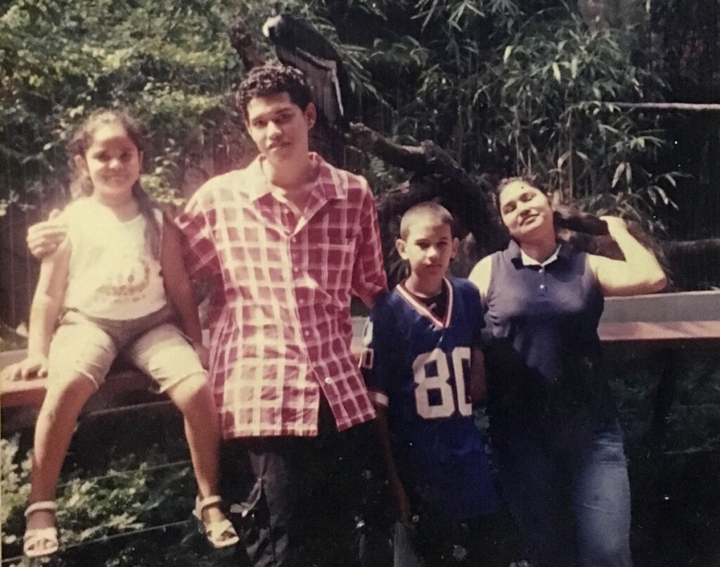 ana_cordero_family_1200 (1) COVID-19 has ripped through communities with high rates of household crowding. Ana Cordero and her family felt that firsthand. An inside look into how the virus spreads in cramped multigenerational homes. Ana (left) as a young girl (at 6 years old) with her family at The Bronx Zoo. (Courtesy of Ana Cordero)