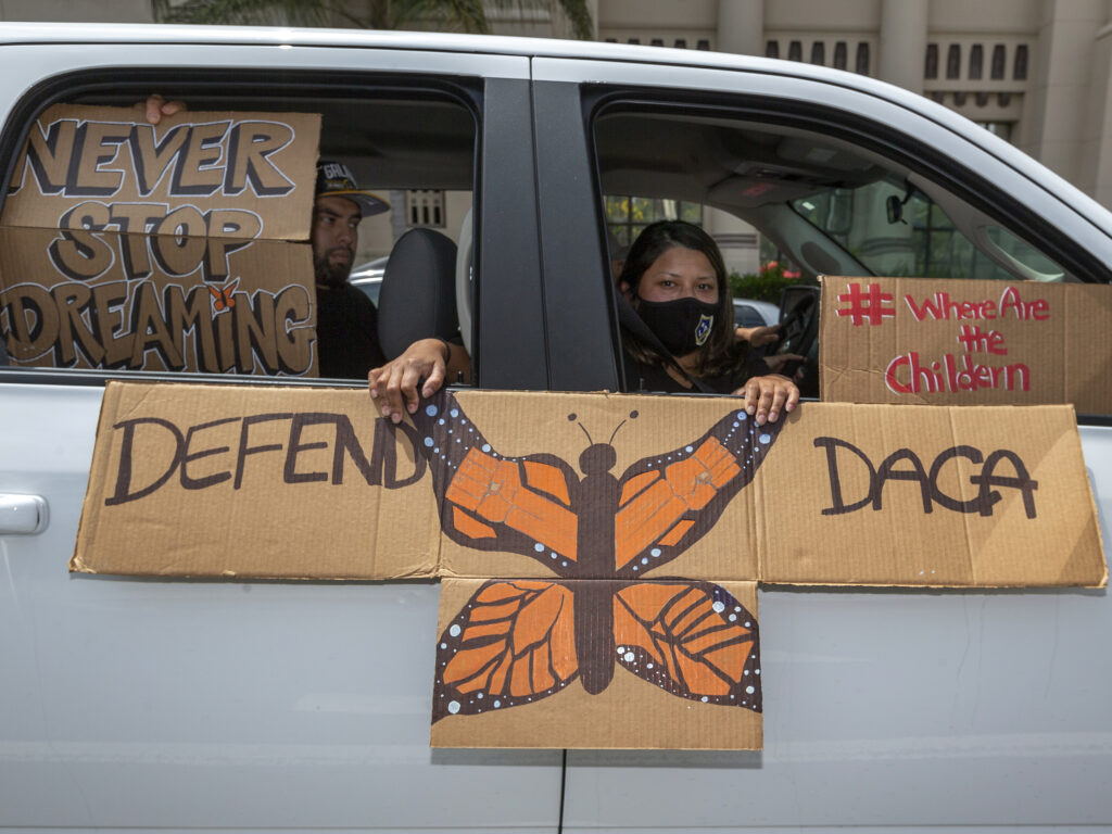 People are pictured demonstrating in June in favor of the Deferred Action for Childhood Arrivals program. Immigrant rights advocates hailed Friday's ruling allowing new applications as a 