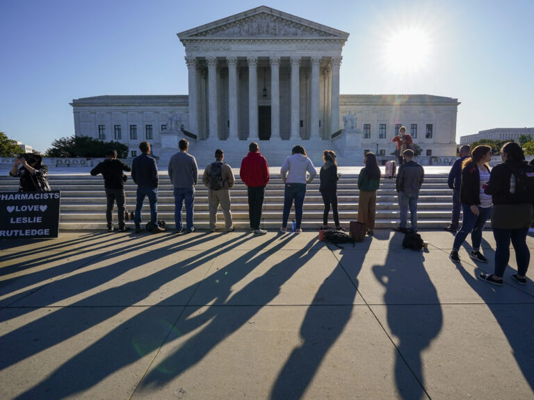 Anti-abortion rights activists demonstrate at the Supreme Court in Washington on Oct. 5. The court's new conservative supermajority puts the fate of Roe v. Wade in doubt. (J. Scott Applewhite/AP Photo)