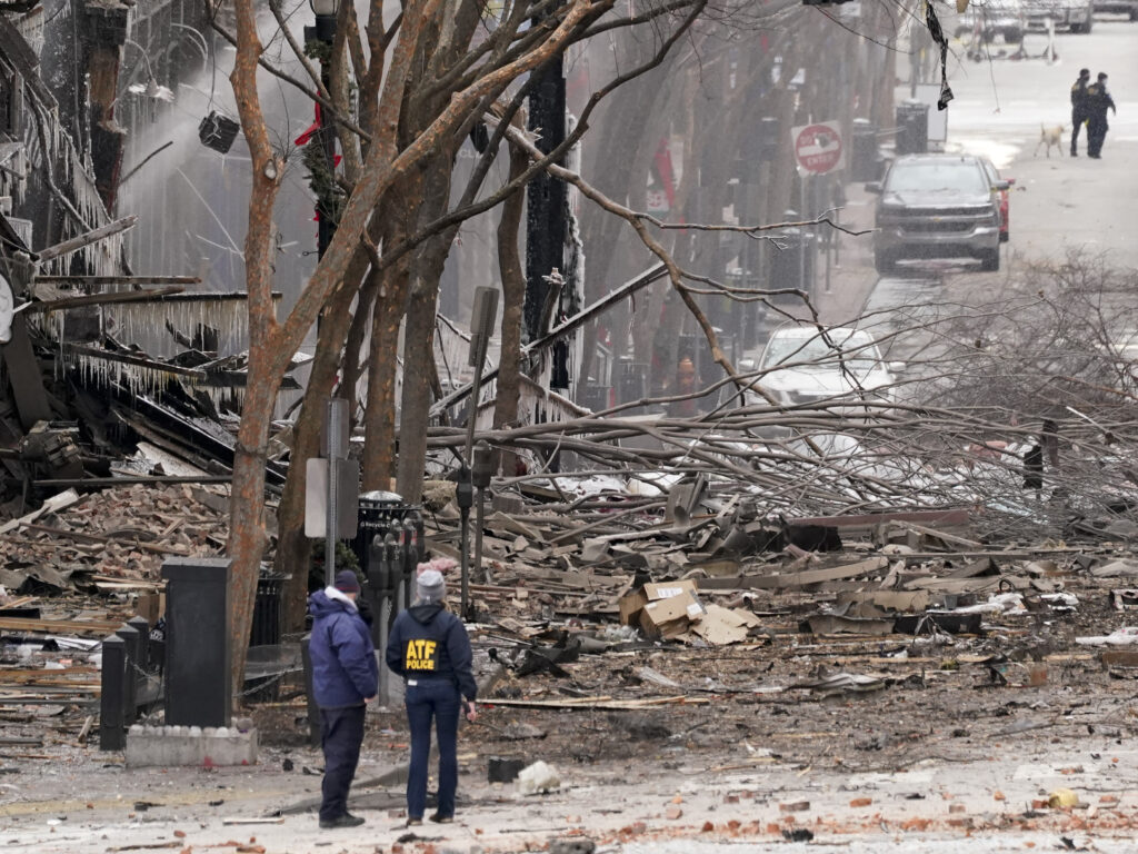 Emergency personnel work near the scene of an explosion in downtown Nashville on Friday. Law enforcement is seeking suspects, and the governor has asked for a federal emergency declaration. Emergency personnel work near the scene of an explosion in downtown Nashville