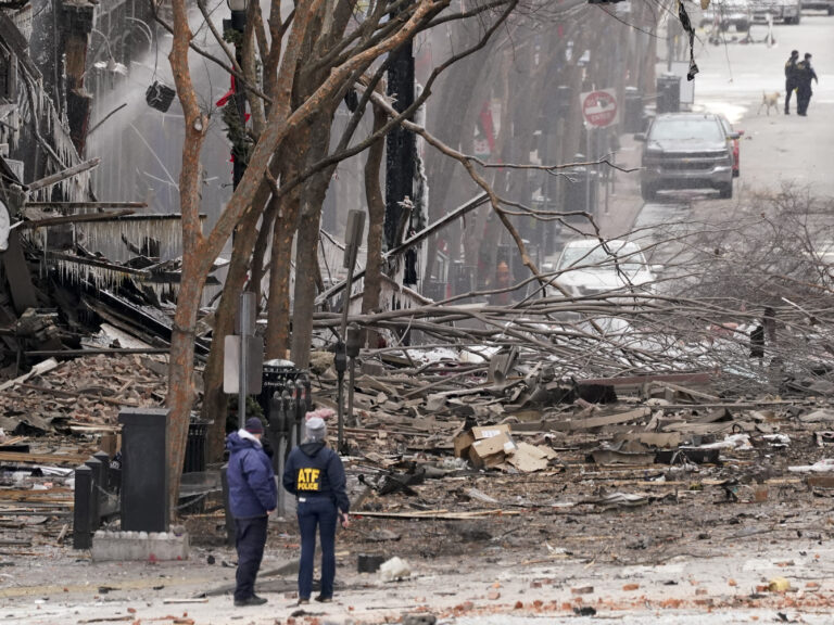 Emergency personnel work near the scene of an explosion in downtown Nashville