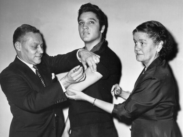 Elvis Presley receives a polio vaccine