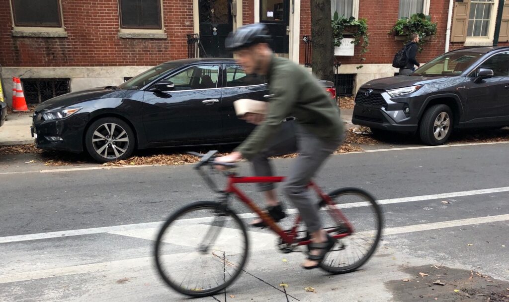 A bicyclist rides over a new bicycle counter embedded under the surface of Center City bike lane. (DVRPC) A bicyclist rides over a new bicycle counter embedded under the surface of Center City bike lane. (DVRPC)