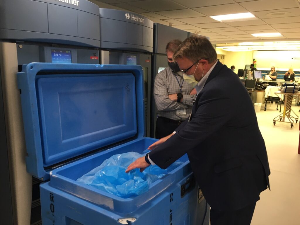 Tim Jennings (foreground) and Jon Horton, officials at Sentara Norfolk General Hospital, have been lining up supplies, including dry ice, in preparation for the coronavirus vaccine. (Sarah McCammon/NPR)