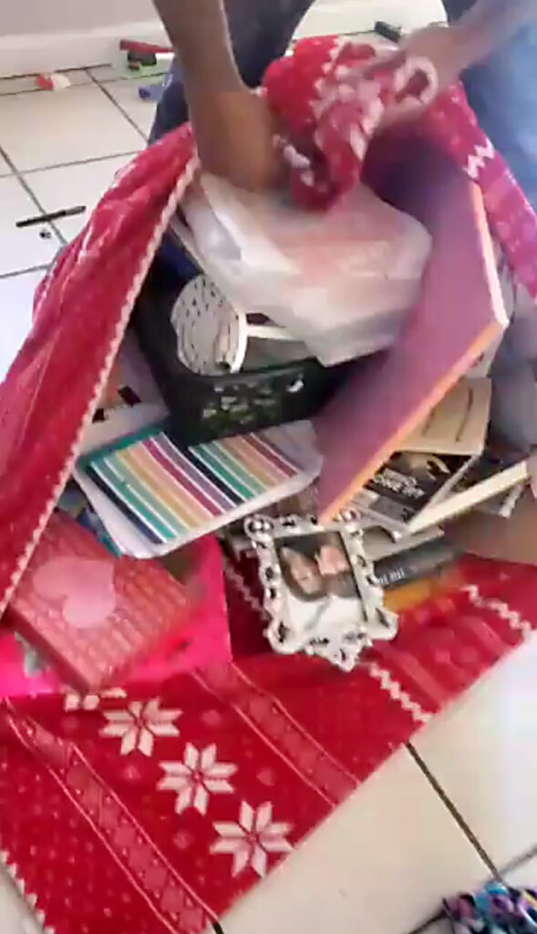 Belongings are gathered inside bedsheets