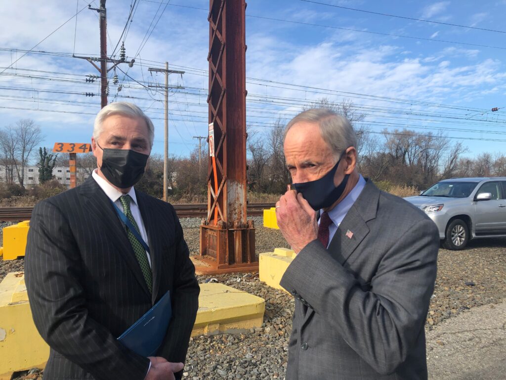 flynn and Carper Amtrak chief executive Bill Flynn (left) and U.S. Sen. Tom Carper, D-Del., both hailed the completion of the project that added a third track along a 1 1/2-mile stretch from Wilmington to Newark. (Cris Barrish/WHYY)