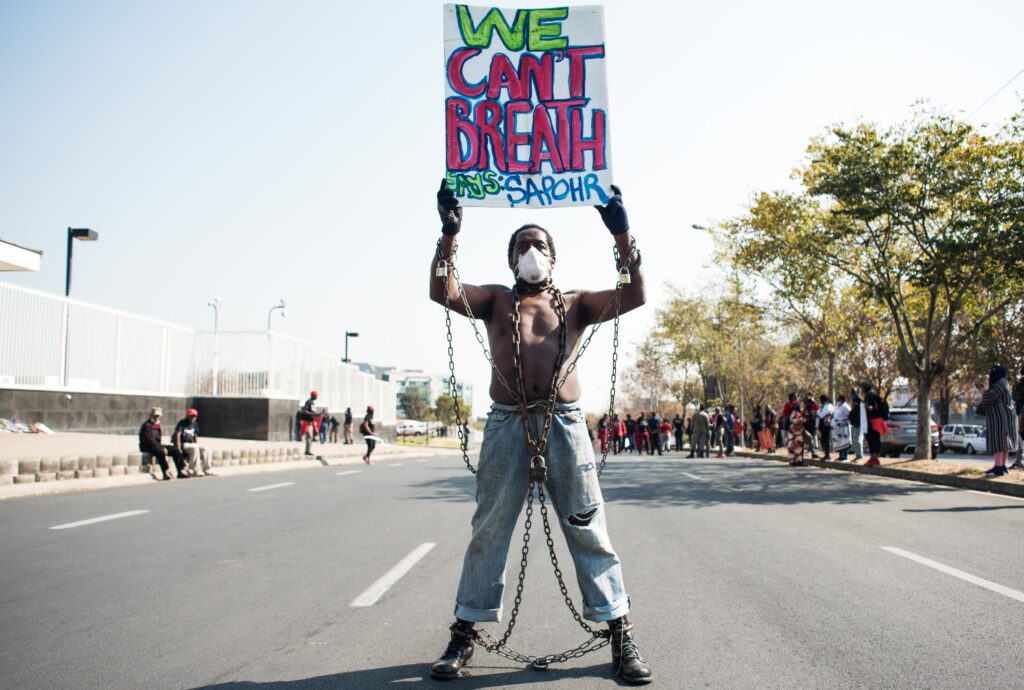 Members of Economic Freedom Fighters (EFF) protest against the death of George Floyd outside U.S. Consulate in solidarity with Black Lives Matter movement on June 8, 2020 in Sandton, South Africa. Members of Economic Freedom Fighters (EFF) protest against the killing of George Floyd outside U.S. Consulate in solidarity with Black Lives Matter movement