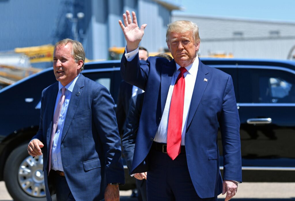 Texas Attorney General Ken Paxton, seen here alongside President Trump in Dallas in June, sued four states that Biden carried in the general election, claiming their changes to election procedures during the pandemic violated federal law. Texas Attorney General Ken Paxton, seen here alongside President Trump in Dallas in June, sued four states that Biden carried in the general election, claiming their changes to election procedures during the pandemic violated federal law. (NICHOLAS KAMM/AFP via Getty Images)