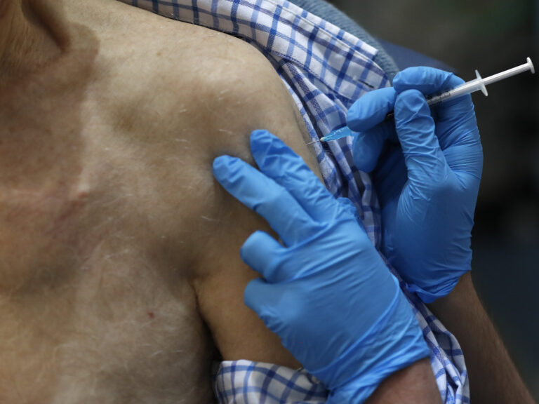 A nurse administers the Pfizer-BioNTech COVID-19 vaccine at Guy's Hospital