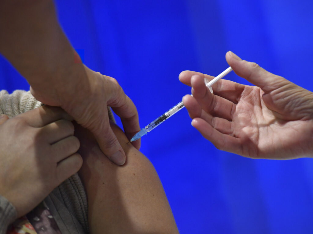 Health care workers will be among the first to receive a COVID-19 vaccine when they become available. But the vaccines have not been tested on pregnant women, raising questions about whether pregnant and lactating health care workers should get the shots. A woman receives an injection of the Pfizer-BioNTech Covid-19 vaccine at a health centre on the first day of the largest immunisation programme in the UK's history on December 8, 2020 in Cardiff, United Kingdom.
