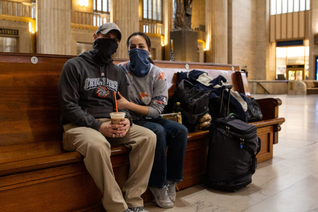 holiday_travel_30th_street_KP122420_04 Gloriana Berry (right) and Kent Berry sit at 30th Street Station