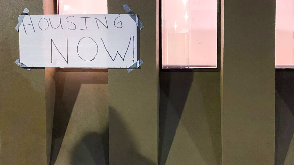 holidayinn-housingprotest A sign reads