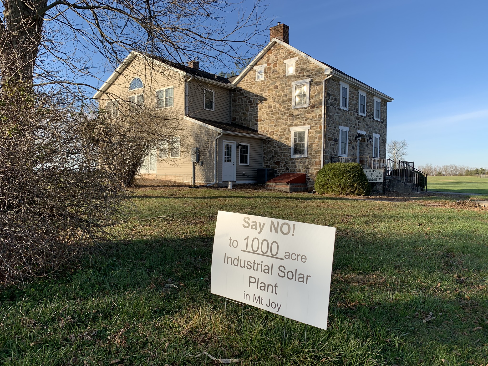 One of the many signs protesting a proposed solar project in Mount Joy Township, Adams County is seen here in front of the Iron Horse Inn on Nov. 24