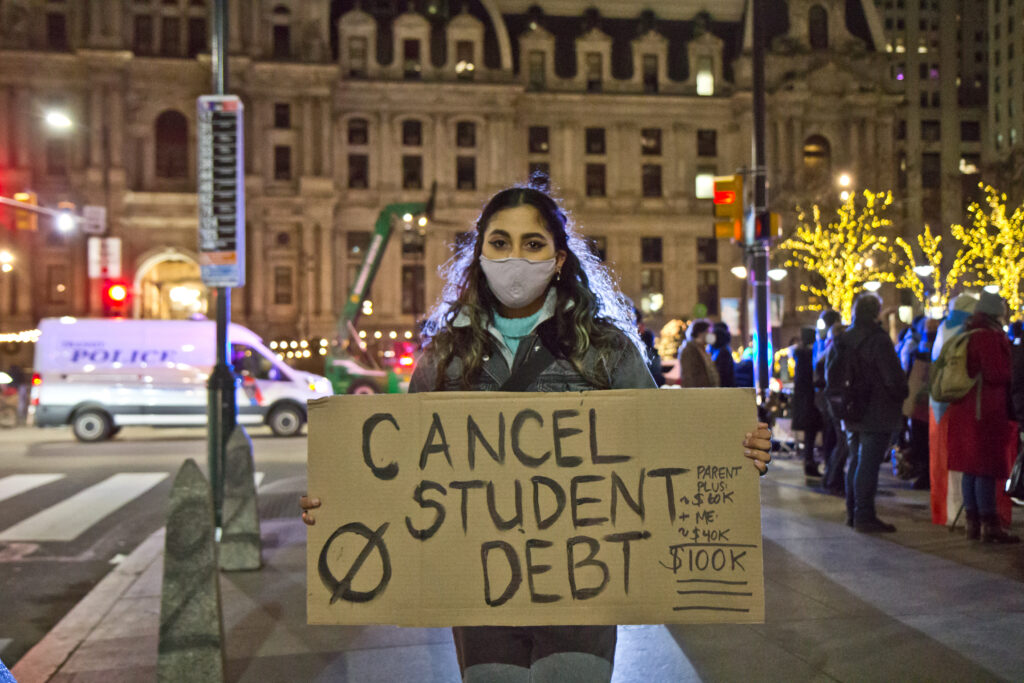 2021 01 04 k paynter student loan protest-2 A protester holds up a sign that says ''Cancel Student Debt''