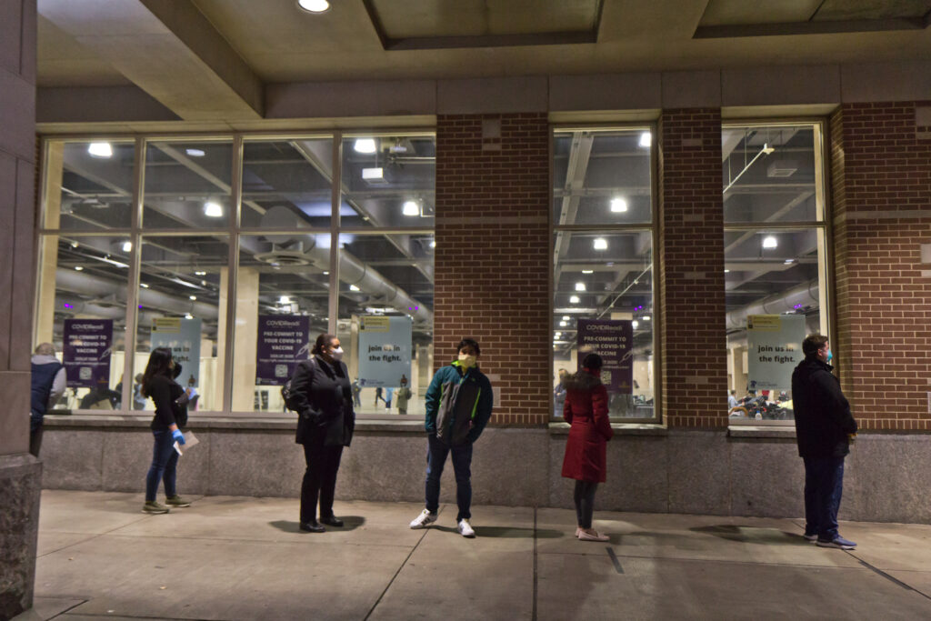 2021 01 08 k paynter convention center vaccine opening-12 Home health workers wait in line outside Philadelphia’s community vaccination clinic at the Pennsylvania Convention Center.