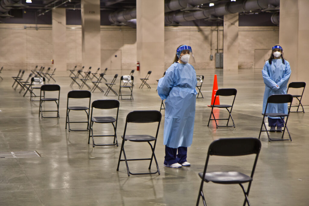 2021 01 08 k paynter convention center vaccine opening-5 After receiving the vaccination, patients wait under observation at the mass vaccine clinic at the Pennsylvania Convention Center. (Kimberly Paynter/WHYY)