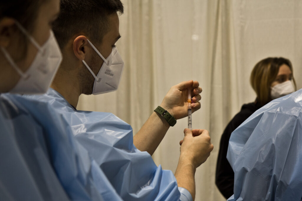 2021 01 08 k paynter convention center vaccine opening-8 A nurse trains others on how to administer a COVID-19 vaccination at Philly Fighting COVID's vaccination clinic at the Pennsylvania Convention Center on Jan. 8, 2021. (Kimberly Paynter/WHYY)