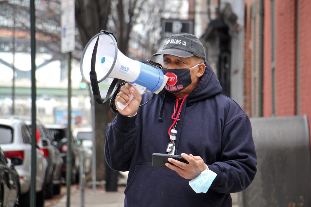 2021 01 14-e lee-jamal johnson-philadelphia 3rd and race streets-gun violence protest Jamal Johnson uses a megaphone at 3rd and Race streets outside the home of Mayor Jim Kenney