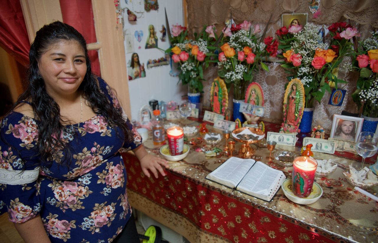 The altar at the apartment is one where all women contribute and take time to pray. | El altar del apartamento es uno en el que todas las mujeres contribuyen y se toman el tiempo para orar.(Tony Rocco/WHYY)